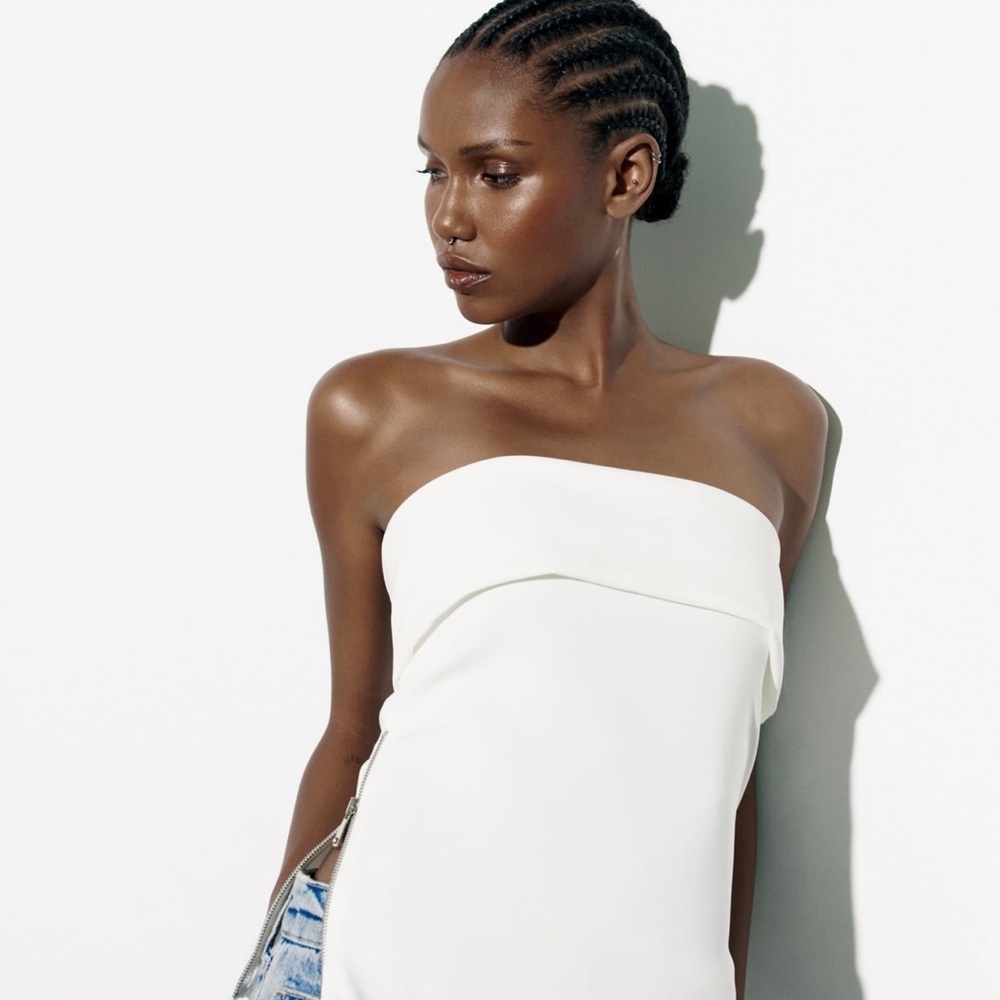 Zara Strapless white top with zippered hem. Brand new. Never worn.